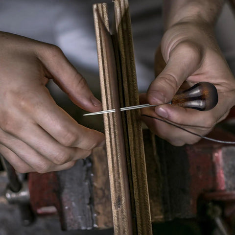 Badass Professional Grade Three Pack Leather Awl Tools with grippy gourd shaped wooden handles used for precise piercing in leather.