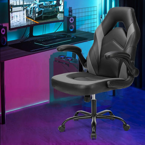 Ergonomic Gaming Desk Chair With PU Leather Upholstery in home office setup, showing flip-up armrests and height adjustable base.