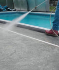 Water Activated 5 Foot Sandless Flood Barrier 4 Pack Self-Inflating Absorbs Water And Rises To Form A Tight Barrier For Quick Flood Control Black in use by a pool.