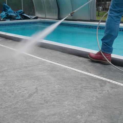 Water Activated 5 Foot Sandless Flood Barrier 4 Pack Self-Inflating Absorbs Water And Rises To Form A Tight Barrier For Quick Flood Control Black in use by a pool.