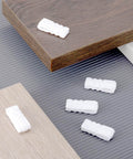 Reddish ten pack vacuum storage bags sealing clips set with reusable zipper grips on wooden boards for space saving and food preservation