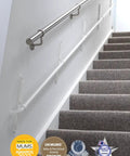 Fully Adjustable Toddler Stair Handrail Built Like A Tank For Little Ones Grows With Your Kid To Deliver Kid Approved Safety And Rock Solid Support Down Each Step Zero Hassle Standard Mount Kit installed on carpeted stairs with wall mounting.