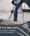 Worker using heavy-duty rotary hammer drill with 16 Inch 3 Piece Masonry Chisel Set SDS Max Shank Compatible for concrete work.