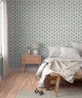 Sick Periwinkle Matte Wallpaper With Subtle Linen Texture covering a cozy bedroom wall with a light wood bed and bedside table.