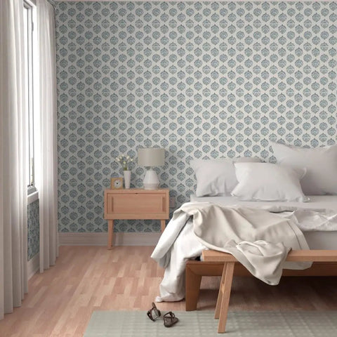 Sick Periwinkle Matte Wallpaper With Subtle Linen Texture covering a cozy bedroom wall with a light wood bed and bedside table.