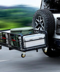 Heavy Duty Folding Hitch Cargo Carrier With 750 Pounds Capacity Fits Two Inch Receiver Includes Wheels And Handle attached to SUV