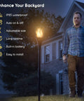 Man walking near Solar Torch Light With Realistic Flickering Flame, Waterproof Outdoor Tiki Torches With 96 LED Bulbs Creating A Realistic Fire Look, No Wires Needed, Easy Setup, Durable Outdoor Lighting, 4 Pack.