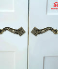 Tentacle Style Door Handle With Vintage Steampunk Look Gothic Pull Knocker for cabinets and doors, installed on white doors.
