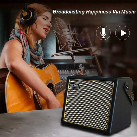 Woman playing acoustic guitar with Portable 30 Watt Acoustic Guitar Amp With Bluetooth Speaker, Rechargeable Battery in foreground