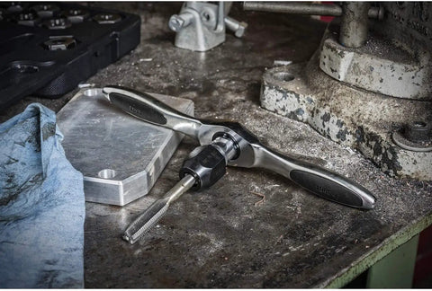 11 Piece Ratcheting Tap And Die Drive Tool Set A Workhorse In Any Shop With Twist Lock Guide System on a workshop table
