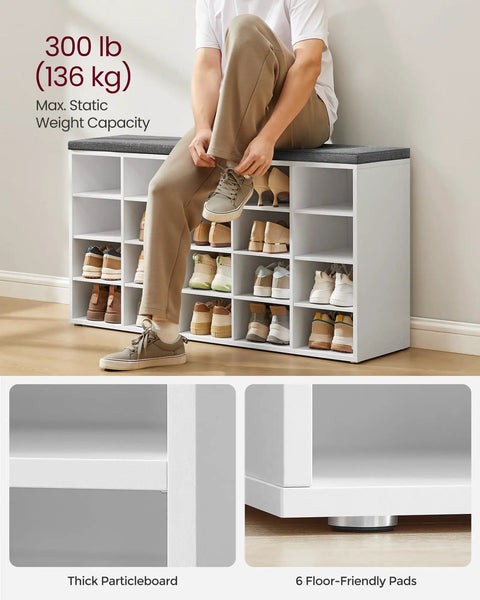Person sitting on open storage shoe bench with padded seat and 20 compartments, cloud white and dove gray, durable, 47.2 in width.