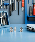 Top Rated Heavy Duty 3 Pc Stainless Steel Needle Grease Gun Fitting Set With Quick Connect Coupler And Extension Rods For All Vehicle Tractor Truck Applications Prevents Oils Spills And Makes Lubrication Easy For Any Busy Mechanic Doing Garage Work. 3 stainless steel grease fittings on blue workbench