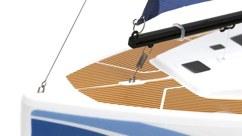 Close-up of Voyager 280 2.4GHz RC Sailboat With Detachable Electric Motor Blue Finish deck and mast. Indoor outdoor use.