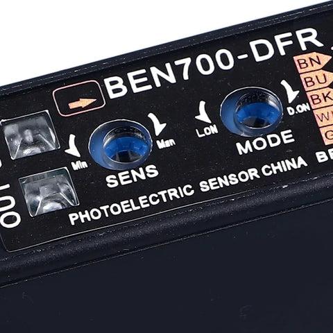 Close-up of BEN700 high accuracy infrared photoelectric beam sensor with mode settings for auto lighting and industrial control.