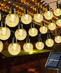 Solar String Lights Outdoor Waterproof 56ft 100 LED Globe Lights With 8 Modes Auto On Off Warm White hanging under pergola
