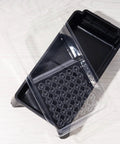 Disposable 4 Inch Paint Tray Liners Set With Plastic Tray And Roller Frame, showing a black tray and clear liner on white surface.