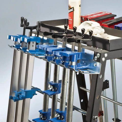 Image of a heavy duty wall mounted pipe clamp rack that keeps clamps in line, built from galvanized steel, holds nine pipe and bar clamps up to 0.30 inches wide.