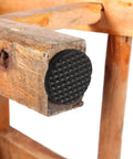 Close-up of 30 Piece Black Nonslip Rubber Feet Pads for Heavy Duty Floor Protection on wooden furniture leg.