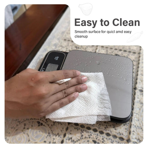 Chef Grade Precision Digital Food Scale With 0.01 Oz And 1 G Readout Waterproof Kitchen Scale being wiped clean on table