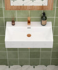 CHIKESI 24"x14" Wall Mount Sink, White Rectangular installed above green tiles with a faucet and decor.
