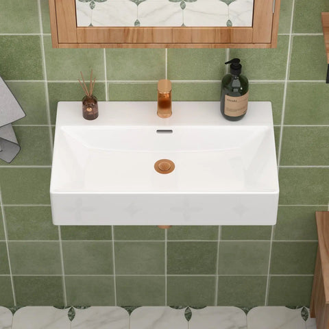 CHIKESI 24"x14" Wall Mount Sink, White Rectangular installed above green tiles with a faucet and decor.