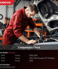 Mechanic working on Ford Focus engine for compatibility check with steering rack and pinion assembly 2000-2005 LHD models.