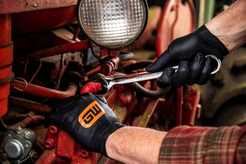 Mechanic using Open End Ratcheting Wrench Set, 8-Piece SAE 12-Point, Quick-Fit Box End, on tractor engine