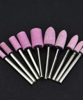 100 Pieces Polishing Stone Head Pro Grade Set For Grinder With 3mm Shank, various shaped burr bits in pink on black background