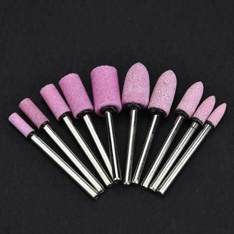 100 Pieces Polishing Stone Head Pro Grade Set For Grinder With 3mm Shank, various shaped burr bits in pink on black background