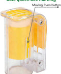 Transparent cage from Six Piece Queen Bee Catcher Cage Set For Beekeeping With One Handed Use, highlighting moving foam button.