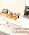 Wall Mounted Folding Table For Garage And Laundry Room Use, Handy Home Wall Desk And Folding Workbench, Space Saver That Handles Up To 100 Lbs, Solid Wall Mount Only, 15.7 By 31.5 Inches, Easy Fold Down Surface used in kitchen setup with toaster.