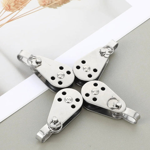 4 Pack Nylon Marine Pulleys with 316 Stainless Steel Bearings on table, compact size, deck-ready for sailboats, yachts, kayaks