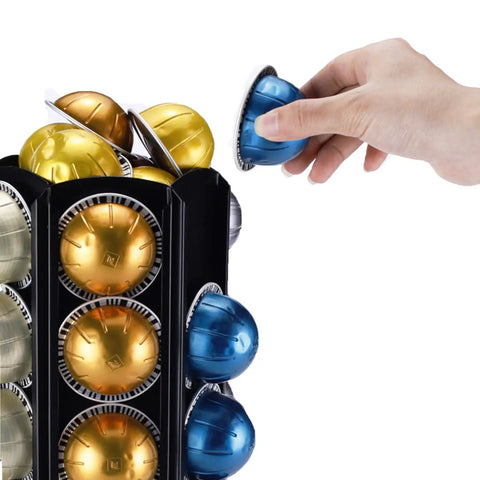 Hand placing pod in Heavy Duty Metal Pod Holder For Nespresso Vertuo Line, 80 Pod Capacity, 360 Degree Carousel, Space Saving