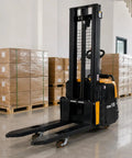 Top Tier Electric Walkie Pallet Stacker With Huge 1500Kg Capacity working in a warehouse, lifting pallets with ease.