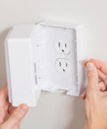 Person installing Locking Outlet Cover Box For Baby Proofing Enclosed Protector For Plugs And Cords Kid Safe Outlet Covers Easy