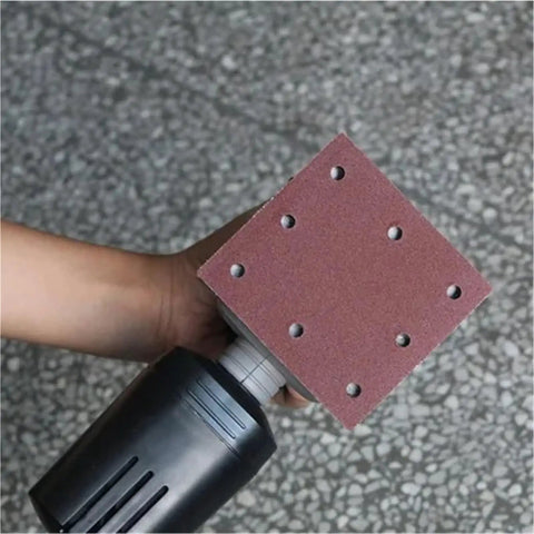 Get This Awesome 20 pc Set of Heavy Duty 115mm Square Sanding Sheets With Eight Holes For Smoothing Wood And Metal Like A Boss, showing sanding sheet with dust holes.