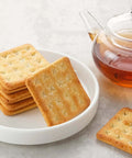 Alltop 5-piece stainless steel biscuit cutter set with handles; square cookies and teapot on white plate