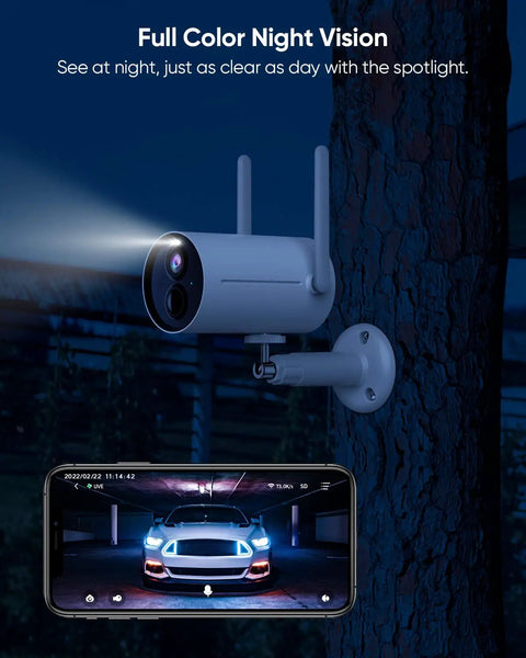 Battery Powered Outdoor Security Camera With Spotlight 1080p HD Color Night Vision Wireless 2 4G WiFi Motion Detection IP65 Weatherproof Dope Home Surveillance System mounted on a tree, spotlight on, phone displaying camera view underneath.