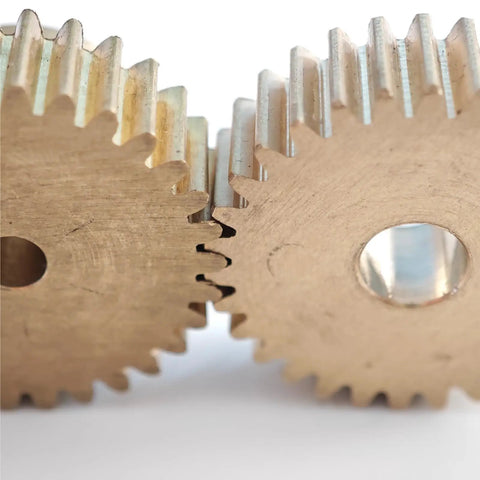 Close-up of two intertwined Beefy 0.5 Module Copper Spur Gears, 82 Teeth, 42mm Diameter, 12.7mm Bore