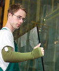 Top Shelf Kevlar Arm Sleeves With Thumb Holes Cut Scratch And Heat Resistant Long Arm Protective Guards in use while handling glass.