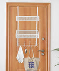 Super Heavy Duty Over The Door Storage Rack With Two Roomy Mesh Baskets And Eight Sturdy Metal Hooks hanging on a wooden door.