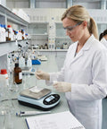 Precision Lab Scale 5000g x 0.01g Digital Balance for Laboratory and Jewelry Weighing in use by scientist in lab.