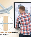 200 Piece Toggle Bolt Kit With Wing Nuts For Drywall One Quarter Inch By Three Inch Heavy Duty Wall Anchors Includes Toggle Bolts And Butterfly Nuts For Home Projects And Small Renovations, man hanging framed picture on drywall