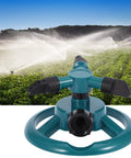 3 Nozzle 360 Degree Circular Rotating Garden Sprinkler For Lawn And Yard in action, spraying water over a green field