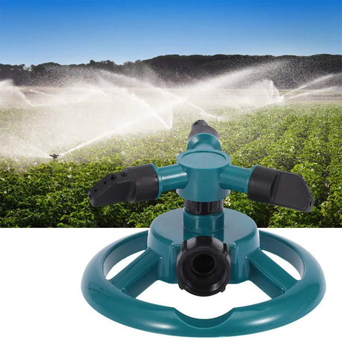 3 Nozzle 360 Degree Circular Rotating Garden Sprinkler For Lawn And Yard in action, spraying water over a green field