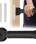 Rock Solid Flip Up Grab Bar For Seniors Eight Point Three Inch Wall Mount safety handle installed on a wooden post with a hand gripping it.
