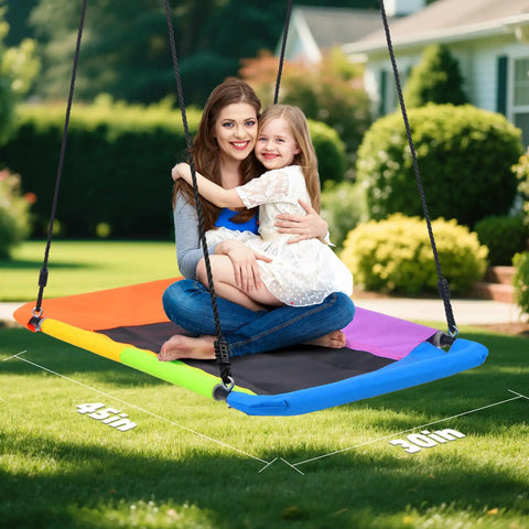 Mother and daughter on 9.5 Foot Tall Swing Set For Backyard Setup With Platform Swing And Trapeze Bar Heavy Duty Metal Frame Green And Brown Outdoor Playground For Kids And Adults Supports Up To 600 Lbs In A Sturdy A Frame.