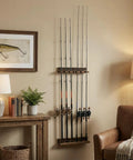 Wall Mounted Burnt Wood Fishing Rod Holder for Garage Adjustable Vertical Pole Rack That Holds Six Rods in living room setting.