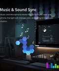 Hexagon RGB LED Light Panels Kit With App Control Smart Wall Mounted DIY Geometric Modular Lights for Home Decor enables music sync in a gaming studio.
