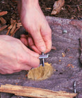 Using Six Pack Natural Jute Fire Starters for Camping and Survival Portable Fire Starter Tools on outdoor surface